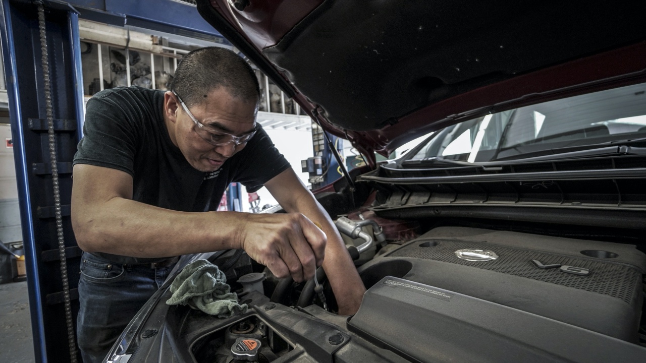 Man repairing the engine of a car