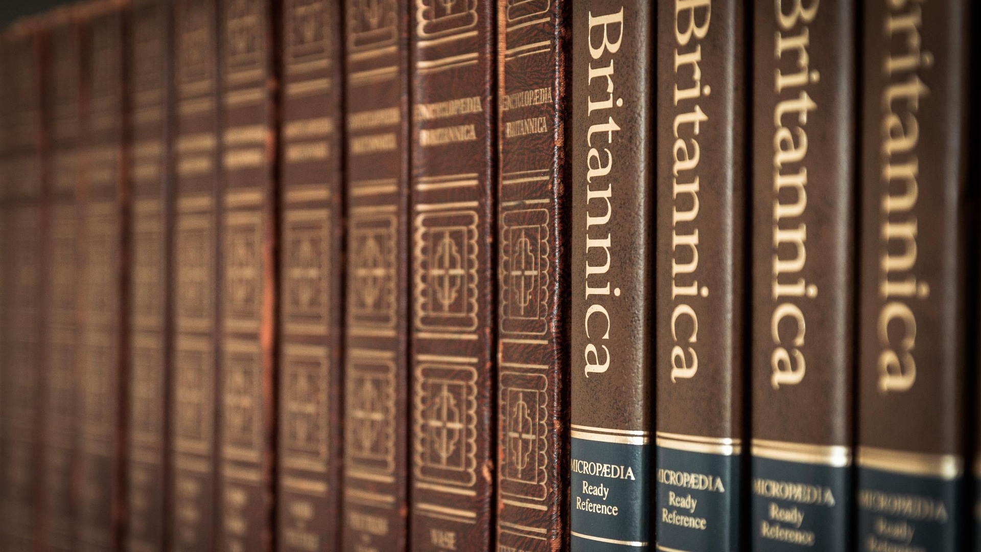 A shelf full of encyclopedias